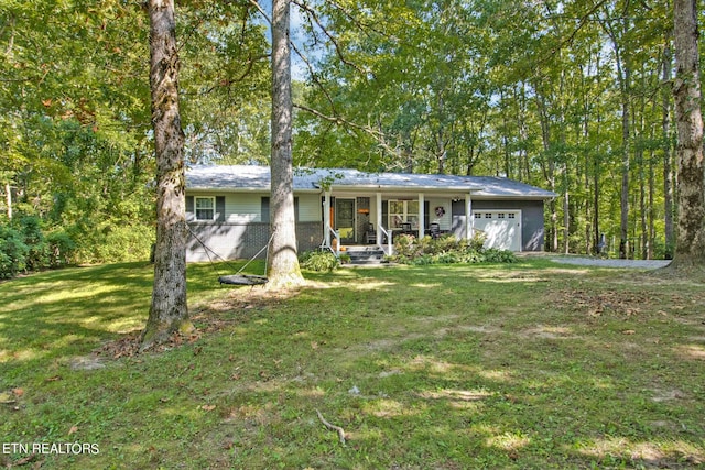 single story home with a porch, a garage, and a front lawn