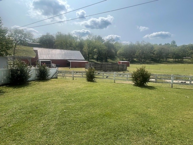 view of yard with a rural view