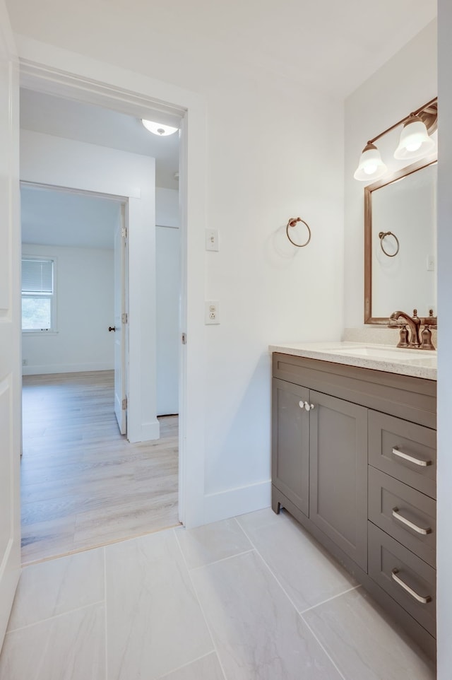 bathroom with vanity and hardwood / wood-style flooring