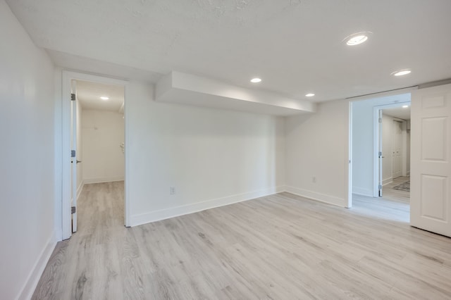 spare room featuring light hardwood / wood-style flooring