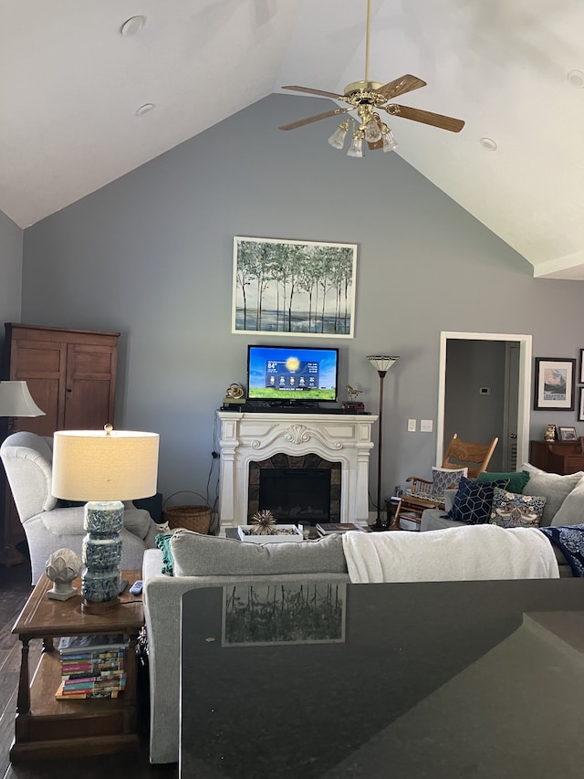 living room featuring ceiling fan and high vaulted ceiling