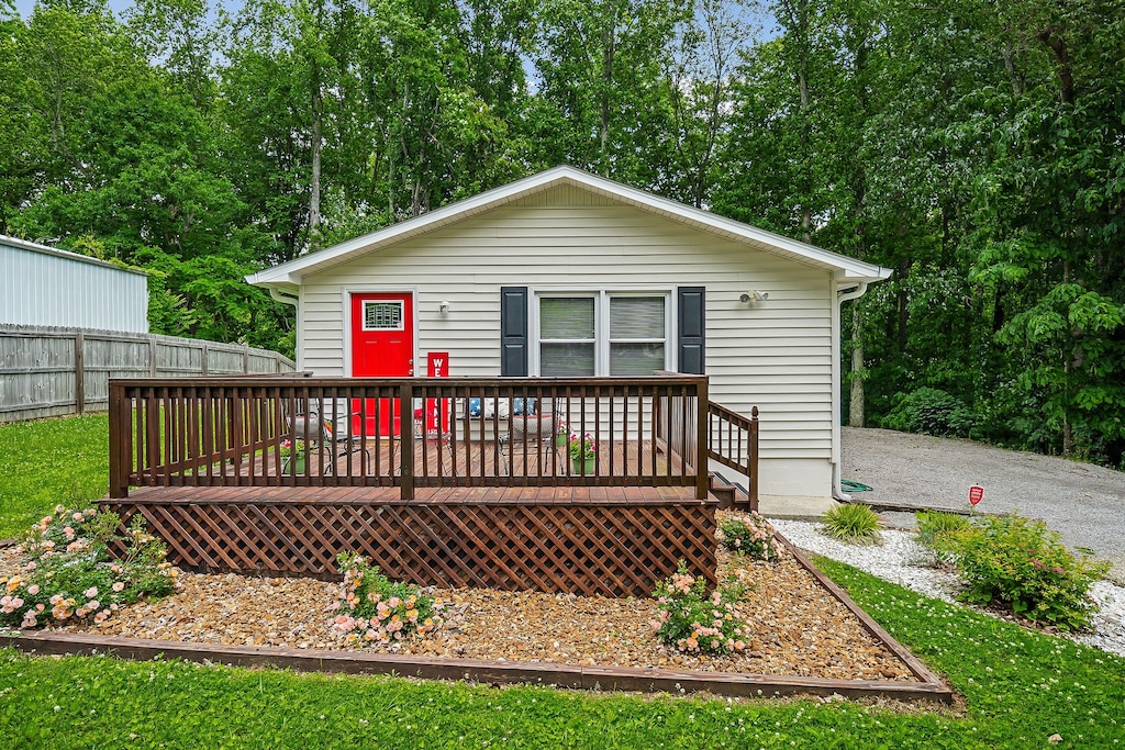 back of property featuring a deck