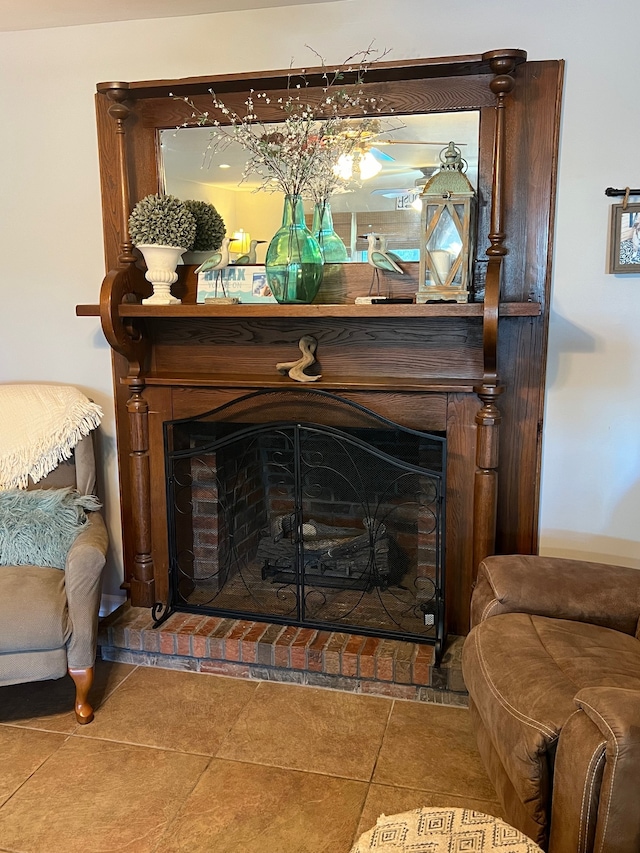 details featuring a brick fireplace and tile patterned flooring