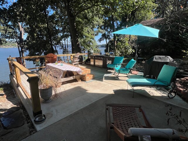 view of patio with a water view