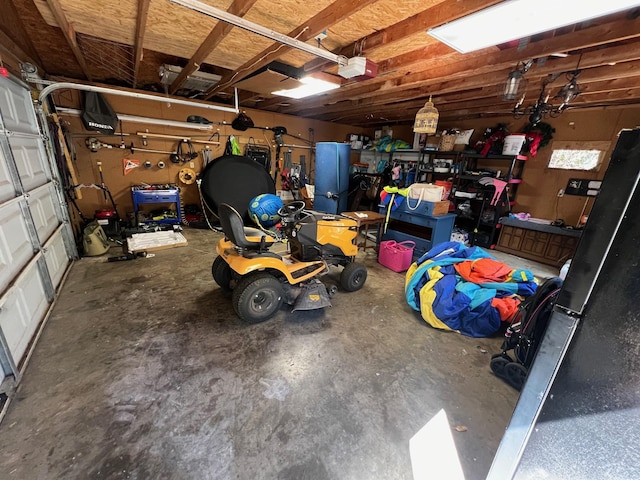 garage featuring a workshop area and a garage door opener
