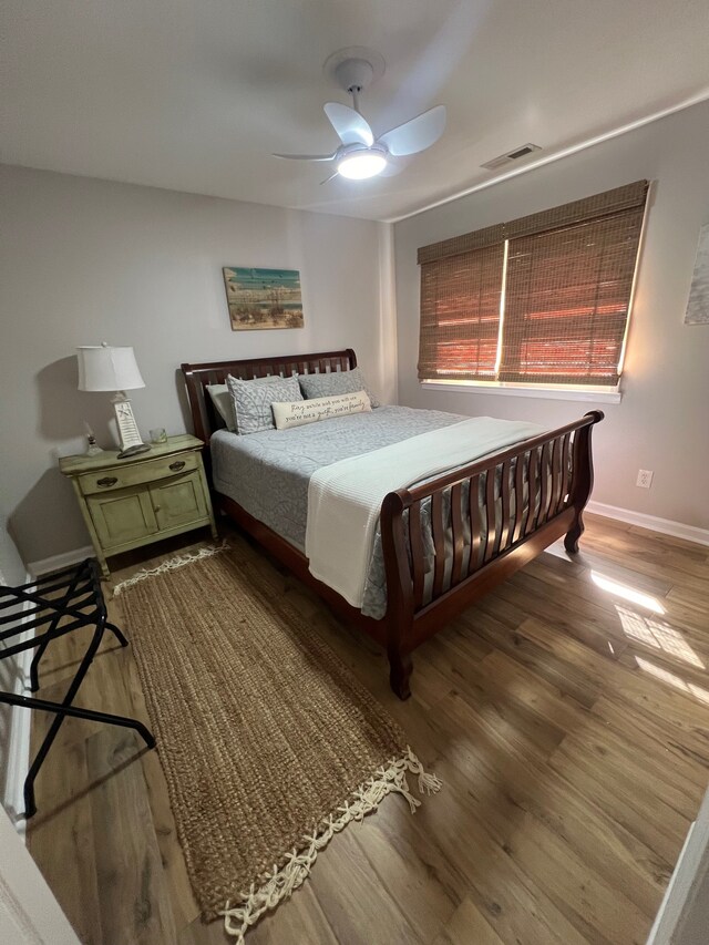 bedroom featuring ceiling fan and wood-type flooring