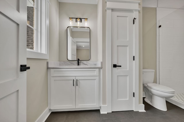 bathroom with vanity, toilet, a shower, and tile patterned flooring