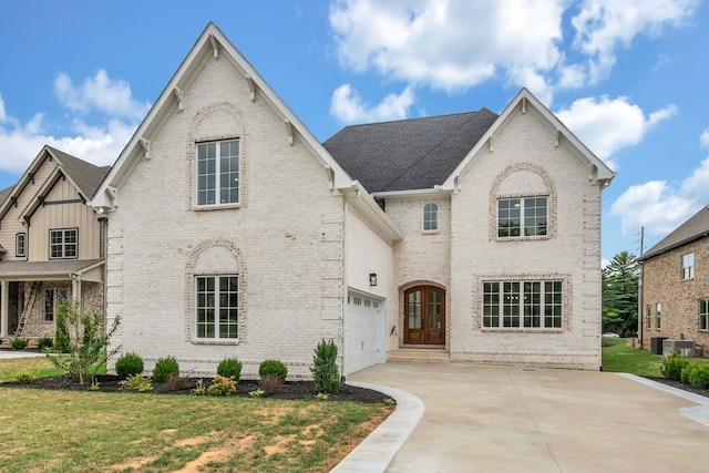 view of front of home featuring a garage and a front lawn