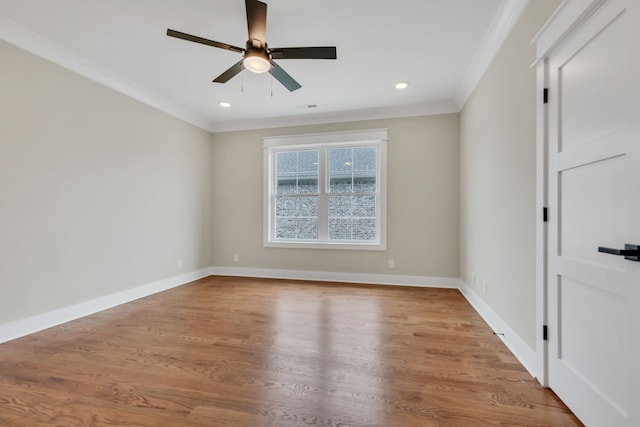 spare room with ceiling fan, crown molding, and light hardwood / wood-style flooring