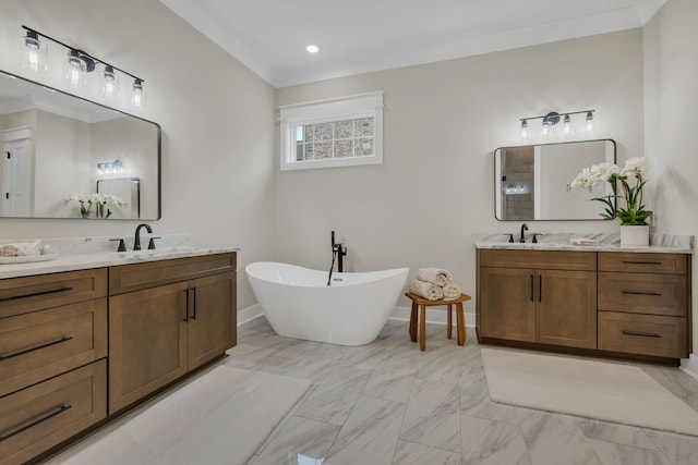 bathroom with a bathing tub, ornamental molding, and vanity