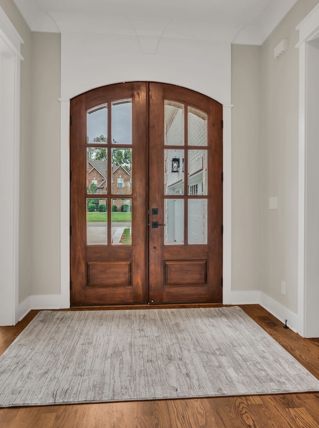 entrance foyer featuring hardwood / wood-style floors and french doors