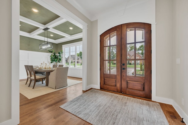 entryway with french doors, coffered ceiling, hardwood / wood-style flooring, and beam ceiling