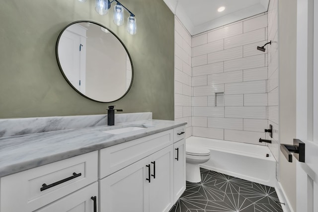 full bathroom featuring vanity, toilet, tiled shower / bath combo, and tile patterned floors