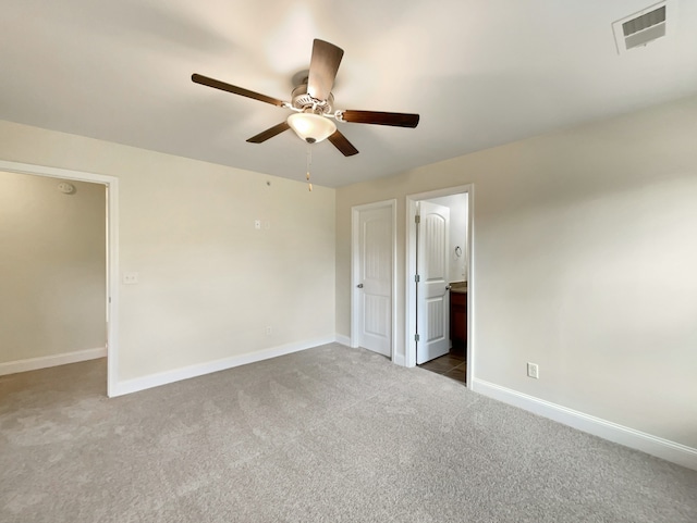 carpeted empty room with ceiling fan