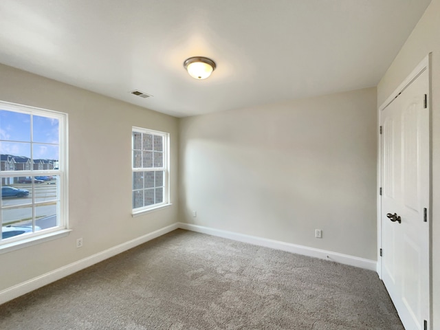 spare room with carpet flooring