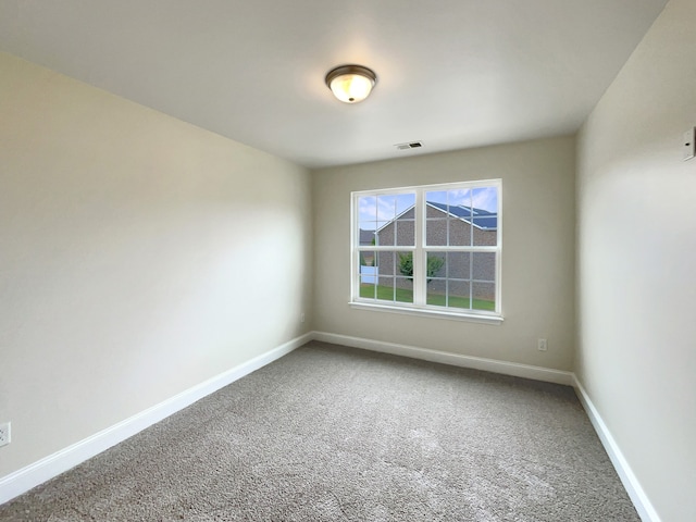 empty room with carpet flooring