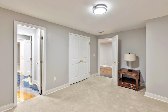 carpeted bedroom featuring a closet