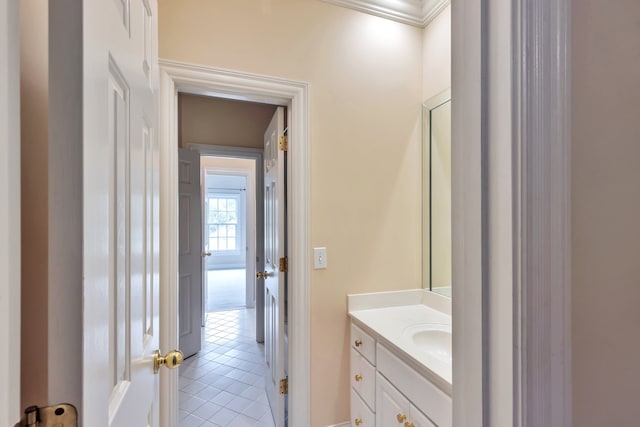 bathroom featuring ornamental molding, tile patterned floors, and vanity