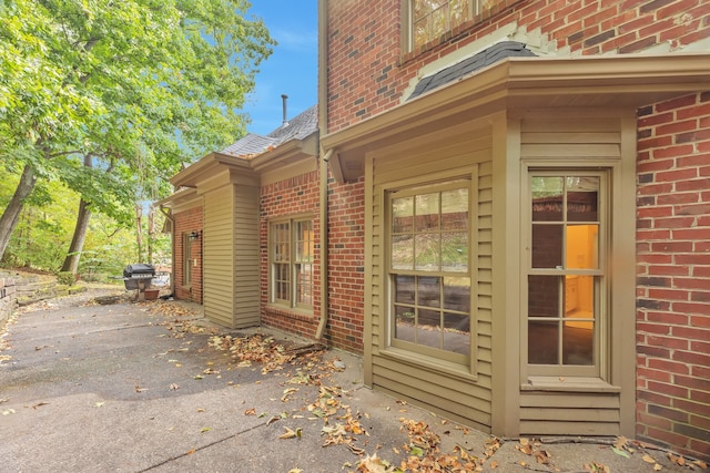 view of side of property with a patio area