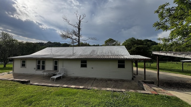 315 Loyd Rd, Pulaski, TN 38478 - back of property with a lawn, a metal roof, and a wooden deck