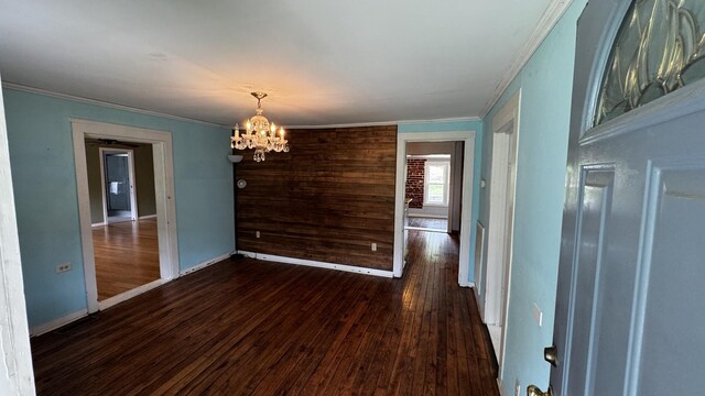 315 Loyd Rd, Pulaski, TN 38478 - unfurnished dining area featuring a chandelier, ornamental molding, and dark wood-style floors