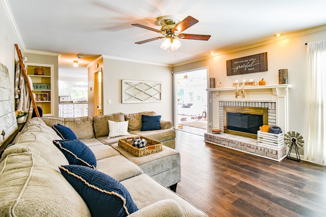 living room with ceiling fan, a fireplace, plenty of natural light, and wood-type flooring