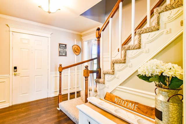 foyer featuring dark hardwood / wood-style floors and ornamental molding