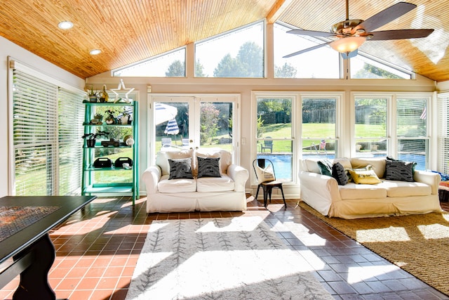 sunroom / solarium featuring ceiling fan and vaulted ceiling with beams