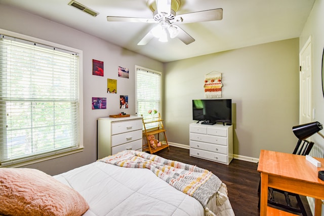 bedroom featuring ceiling fan and dark hardwood / wood-style flooring