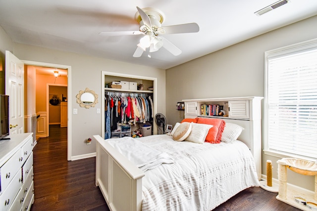 bedroom featuring a closet, ceiling fan, and dark hardwood / wood-style floors