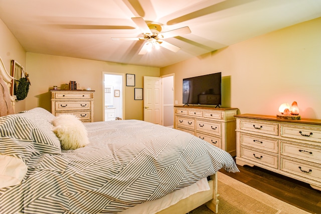 bedroom with ceiling fan and dark hardwood / wood-style flooring