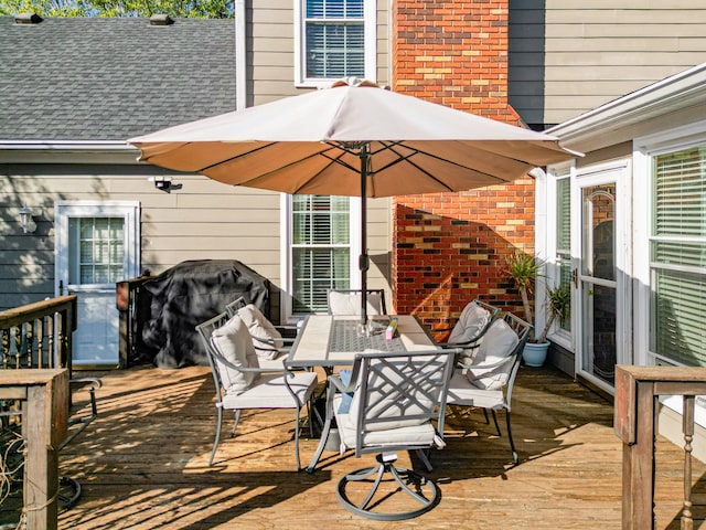 wooden deck with grilling area