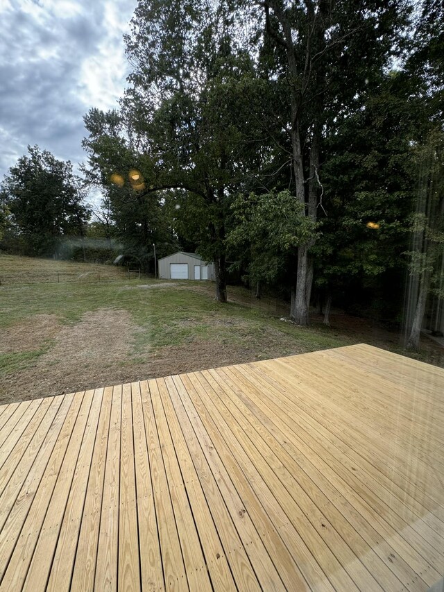 wooden deck featuring a storage unit