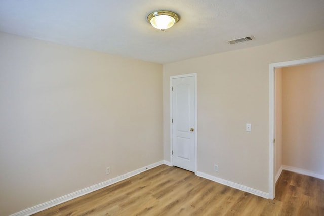 unfurnished bedroom with wood-type flooring