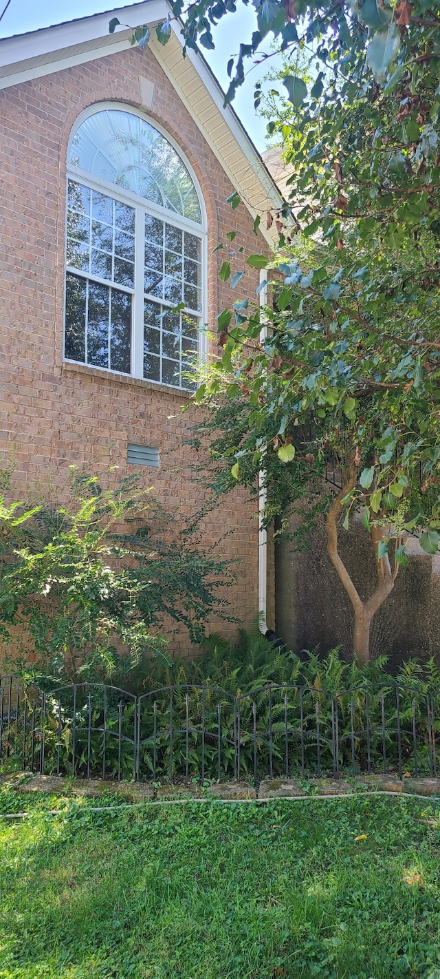 view of home's exterior featuring a lawn