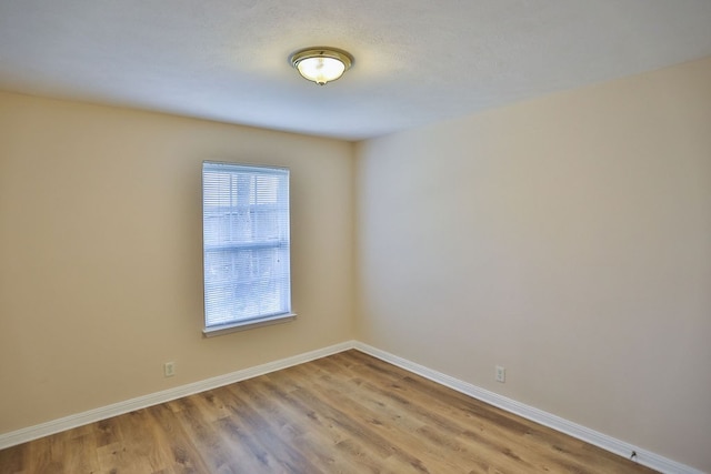 unfurnished room featuring light hardwood / wood-style flooring