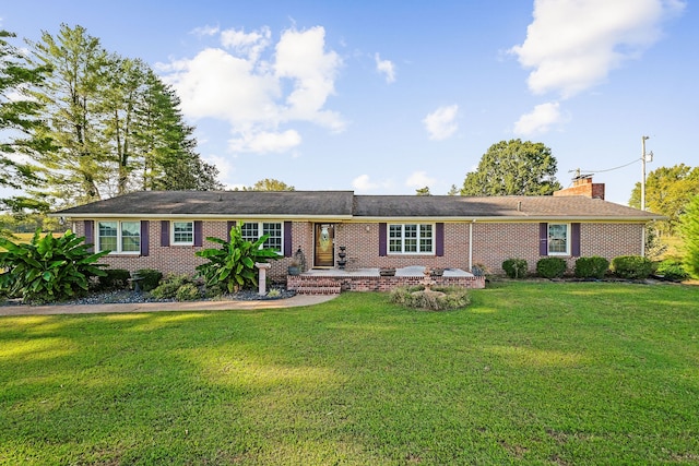 ranch-style home featuring a front yard