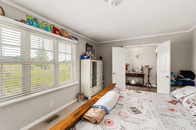 bedroom featuring wood-type flooring and ornamental molding