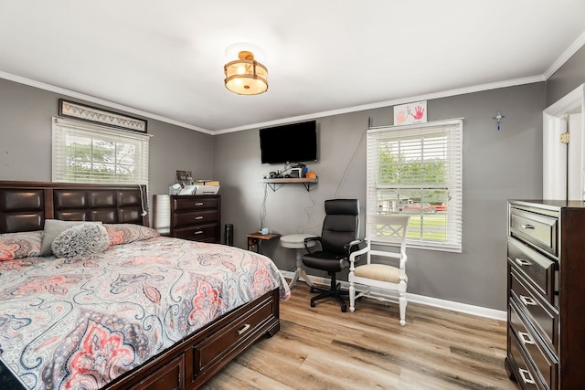 bedroom with light wood-type flooring and ornamental molding