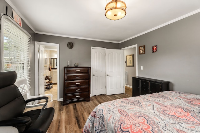 bedroom featuring dark wood-type flooring and ornamental molding