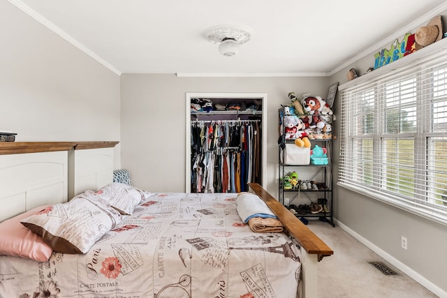 bedroom featuring a closet, carpet flooring, and crown molding