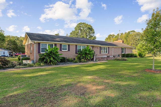 ranch-style home with a front lawn