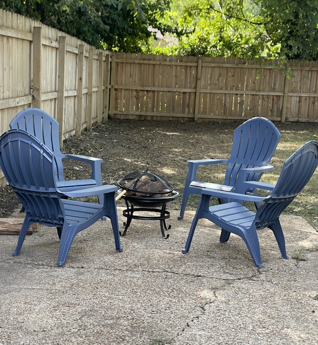 view of patio / terrace featuring an outdoor fire pit