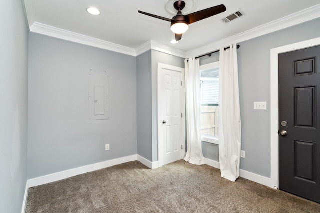 interior space featuring carpet, ceiling fan, crown molding, and electric panel