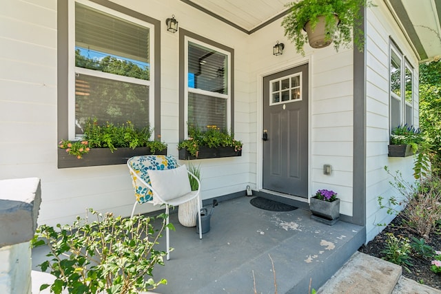 property entrance with covered porch