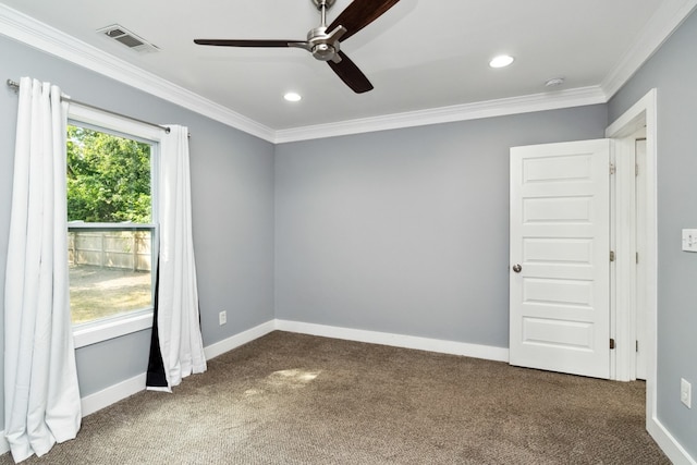 carpeted spare room featuring ceiling fan and crown molding