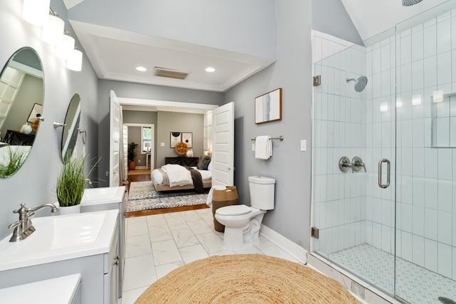 bathroom with vanity, toilet, and a shower with shower door