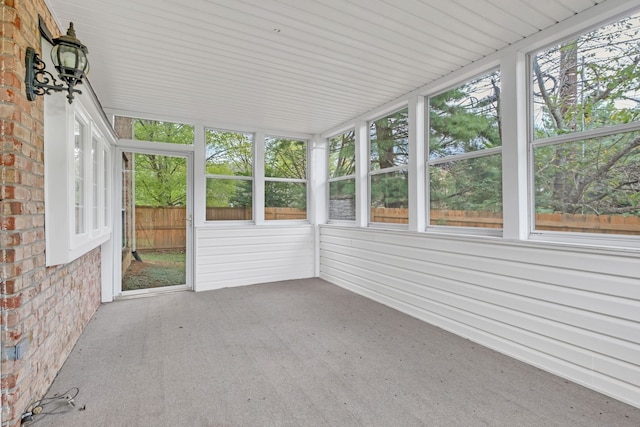 unfurnished sunroom featuring a wealth of natural light