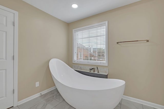 bathroom featuring a washtub