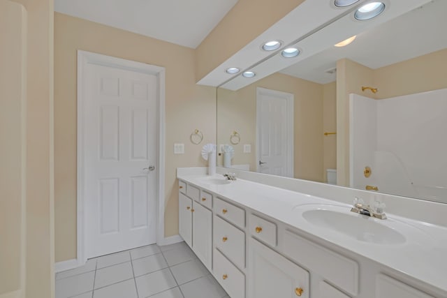 bathroom featuring vanity, toilet, and tile patterned floors